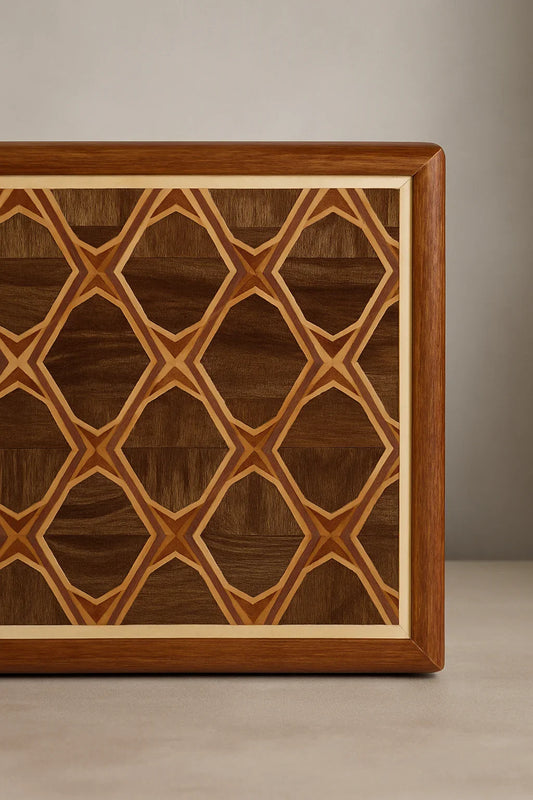 Close-up of a wooden Majlis cutting board with geometric inlay pattern and natural wood frame