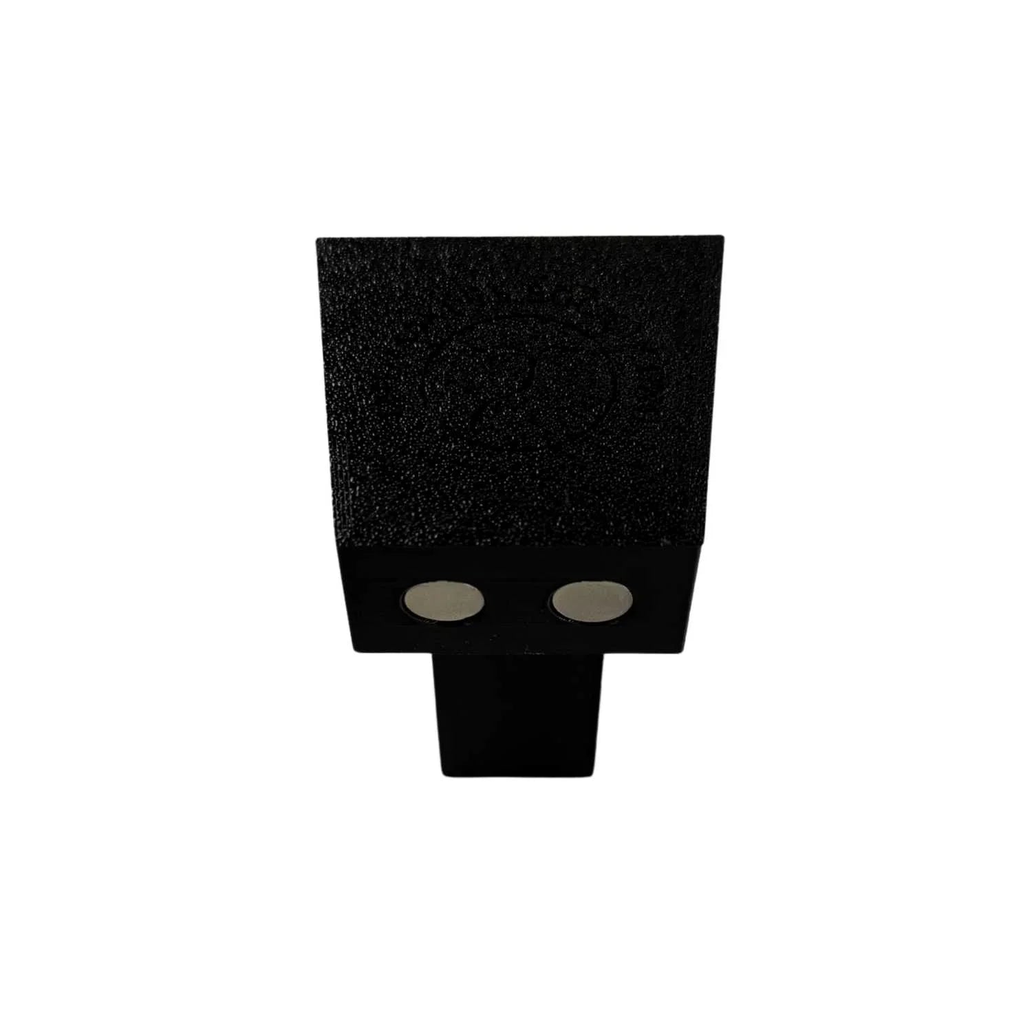 Black dovetail jig accessory with two metal magnets on a white background