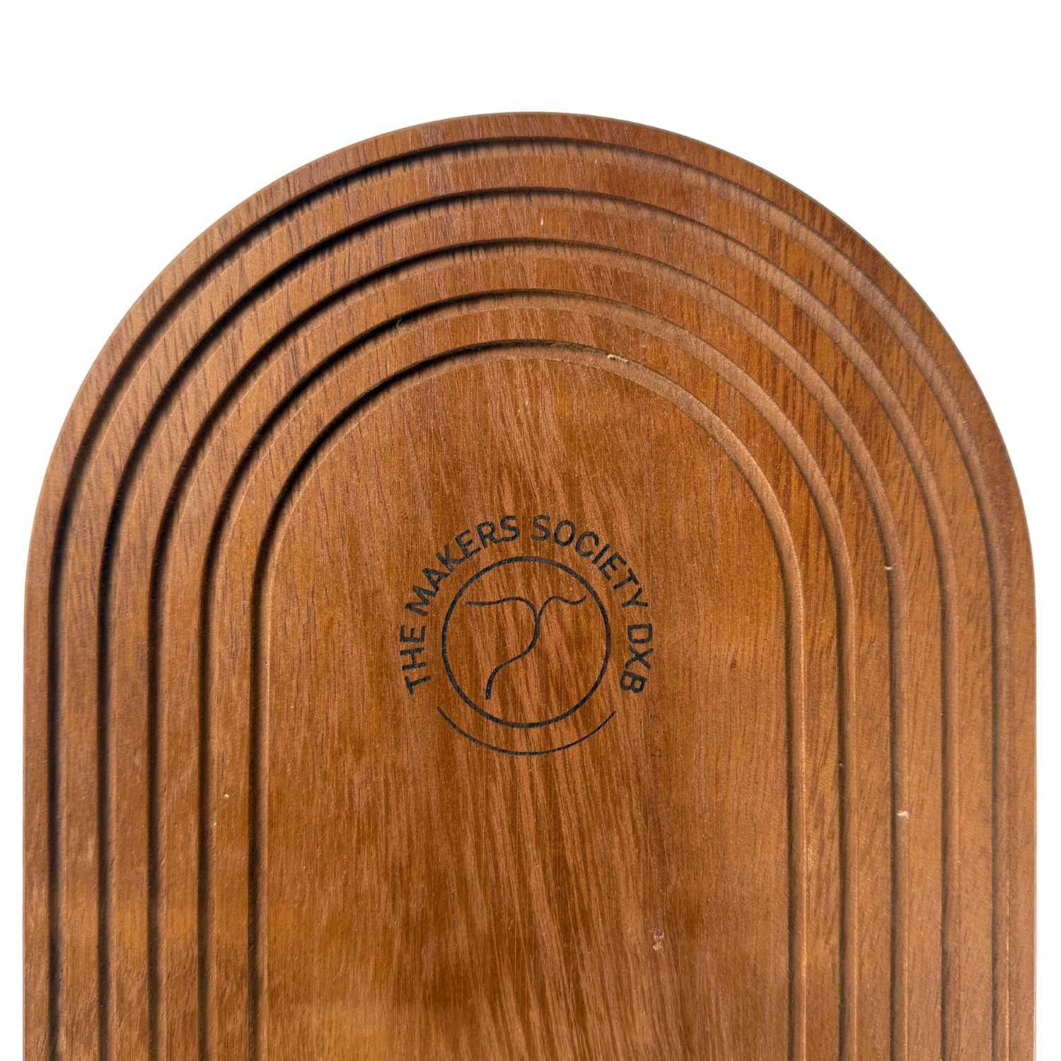 Grooved wooden serving tray with The Makers Society DXB logo engraved in center