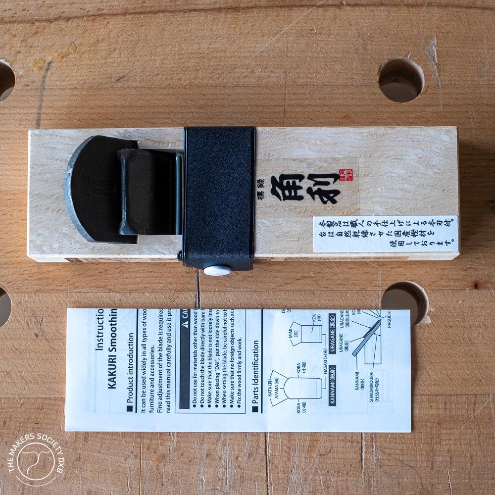 Kakuri Mini plane with white oak body top view with instruction card sold by The Makers Society Dubai