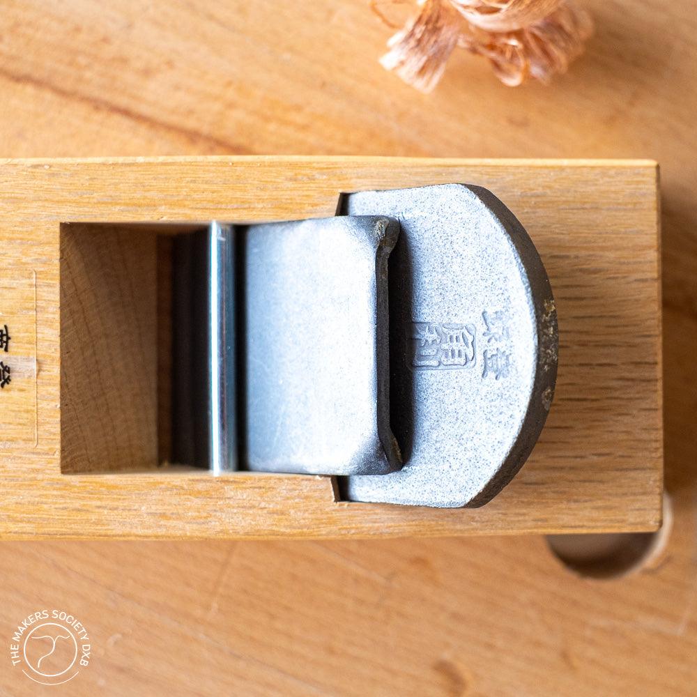 Kakuri Mini plane with white oak body top view close up with Japanese engrave on the blade sold by The Makers Society Dubai