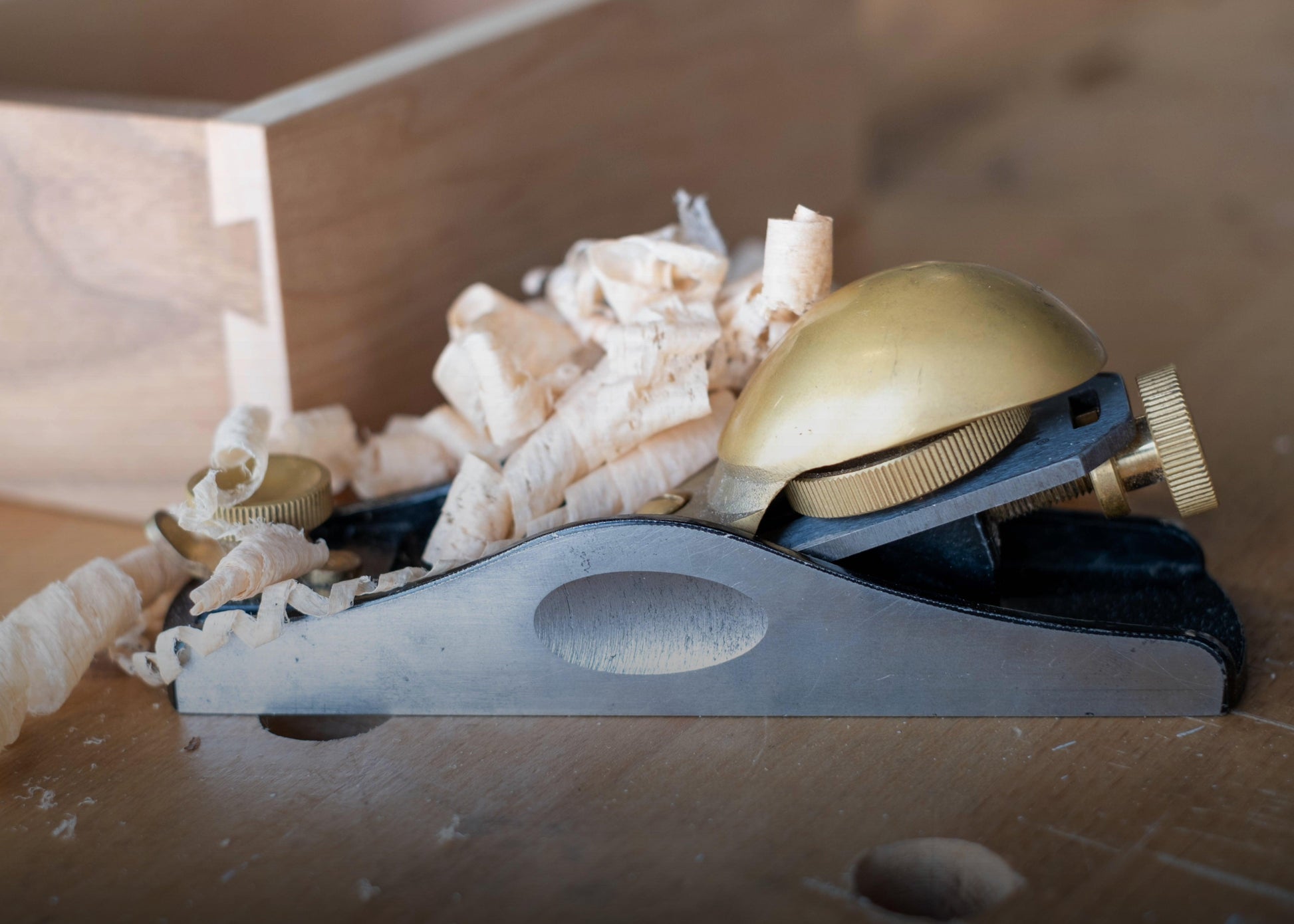 Luban Block Plane 20° Low Angle in action while shaving wood sold by The Makers Society Dubai