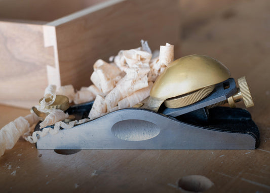 Luban Block Plane 20° Low Angle in action while shaving wood sold by The Makers Society Dubai
