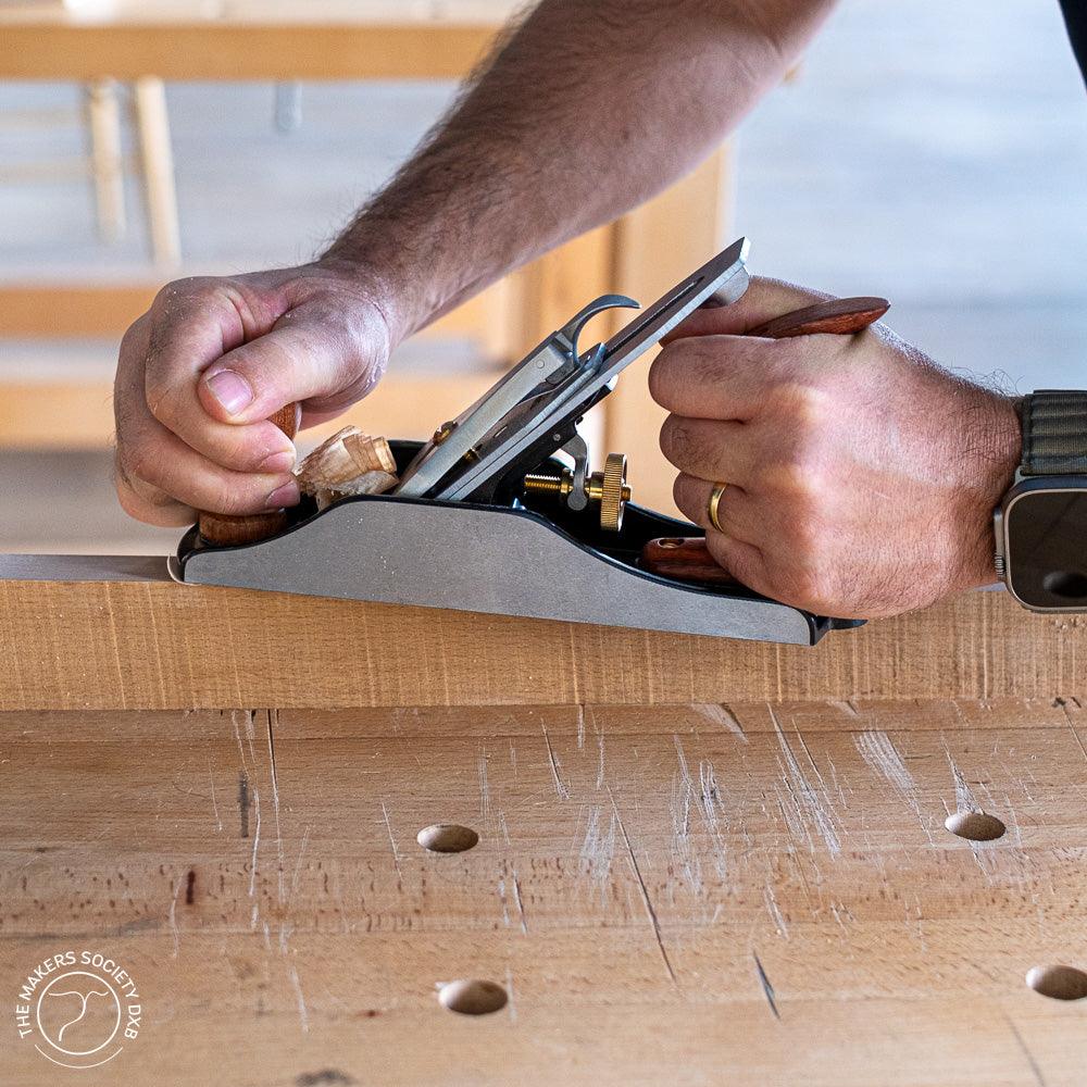 Luban #4 Bench Plane Smoothing Plane in action while shaving wood sold by The Makers Society Dubai