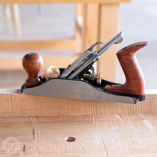 Luban #4 Bench Plane Smoothing Plane sitting on a piece of wood sold by The Makers Society Dubai