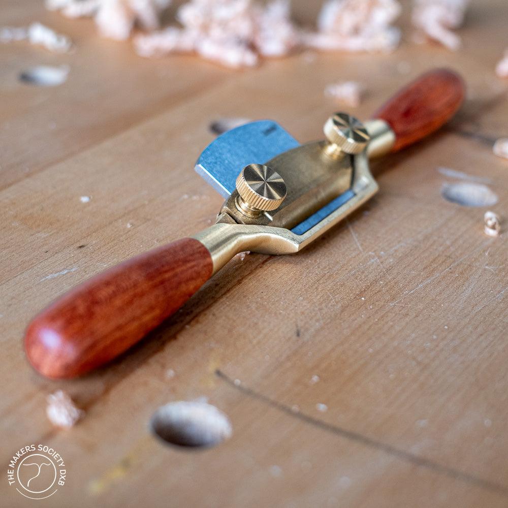 Luban Bronze Spokeshave with curved sole side view sold by The Makers Society Dubai