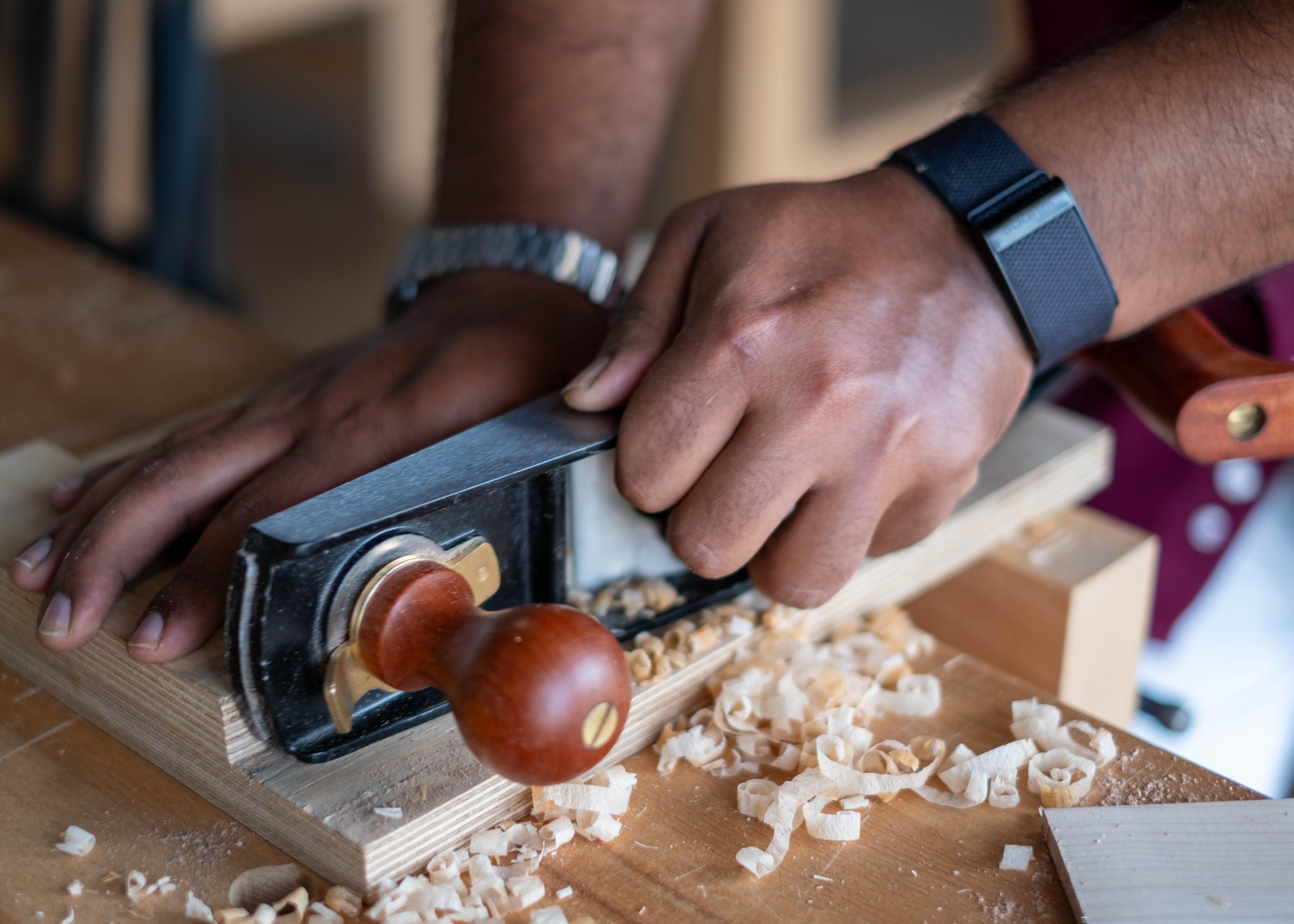 Luban #5 Low Angle Jack Plane in action on a shooting board while shaving end grain wood sold by The Makers Society Dubai