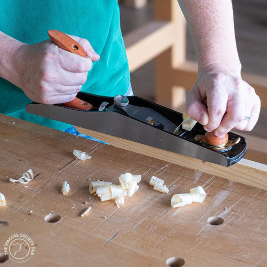 Luban #5 Low Angle Jack Plane in action while shaving wood sold by The Makers Society Dubai