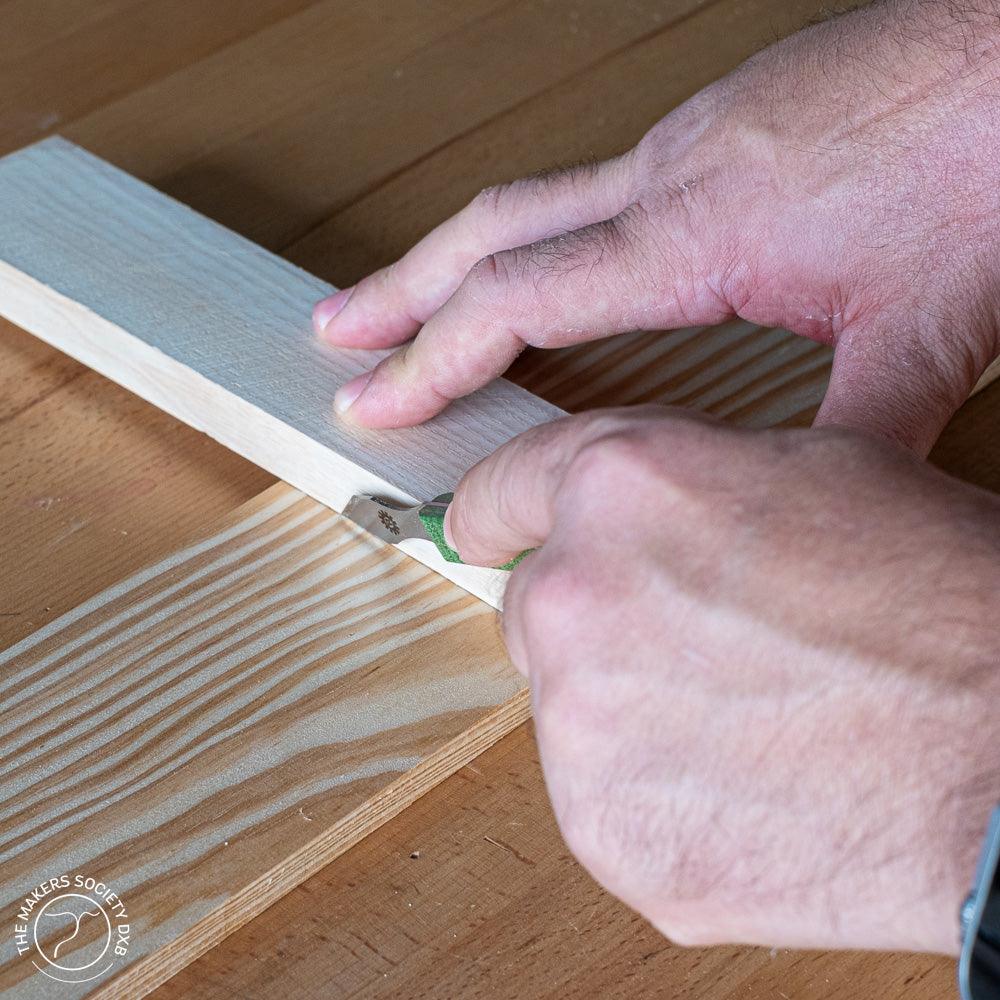 Narex Richter marking knife in action while scoring a piece of wood