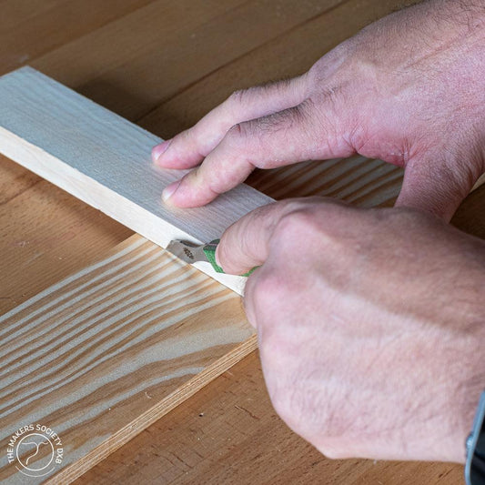 Narex Richter marking knife in action while scoring a piece of wood
