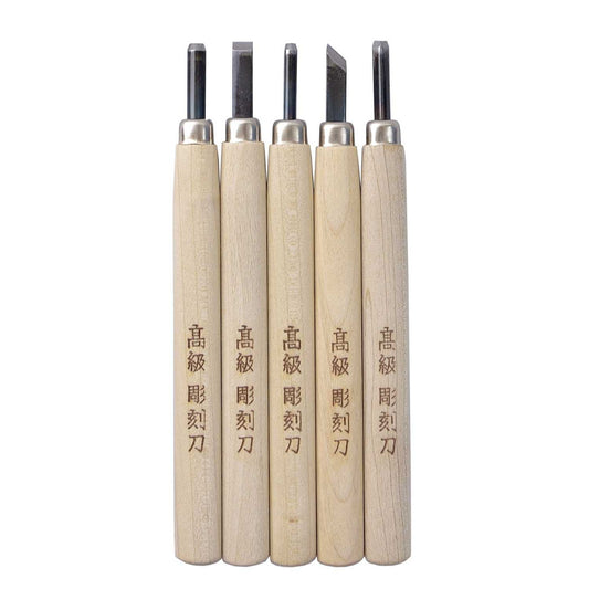 Set of five wooden carving tools with metal blades on a white background
