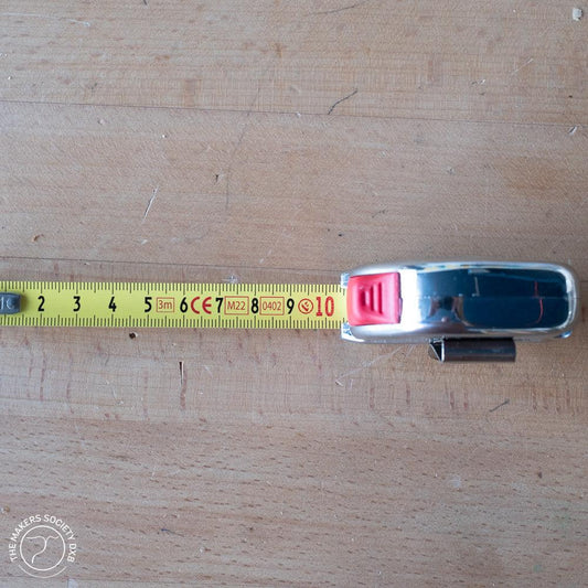 K-MET Tape Measure Festa 2m with tape extended. Compact, precision tape measure with a 2-meter length, durable case, and clear metric markings for accurate measurements, sold by The Makers Society Dubai.