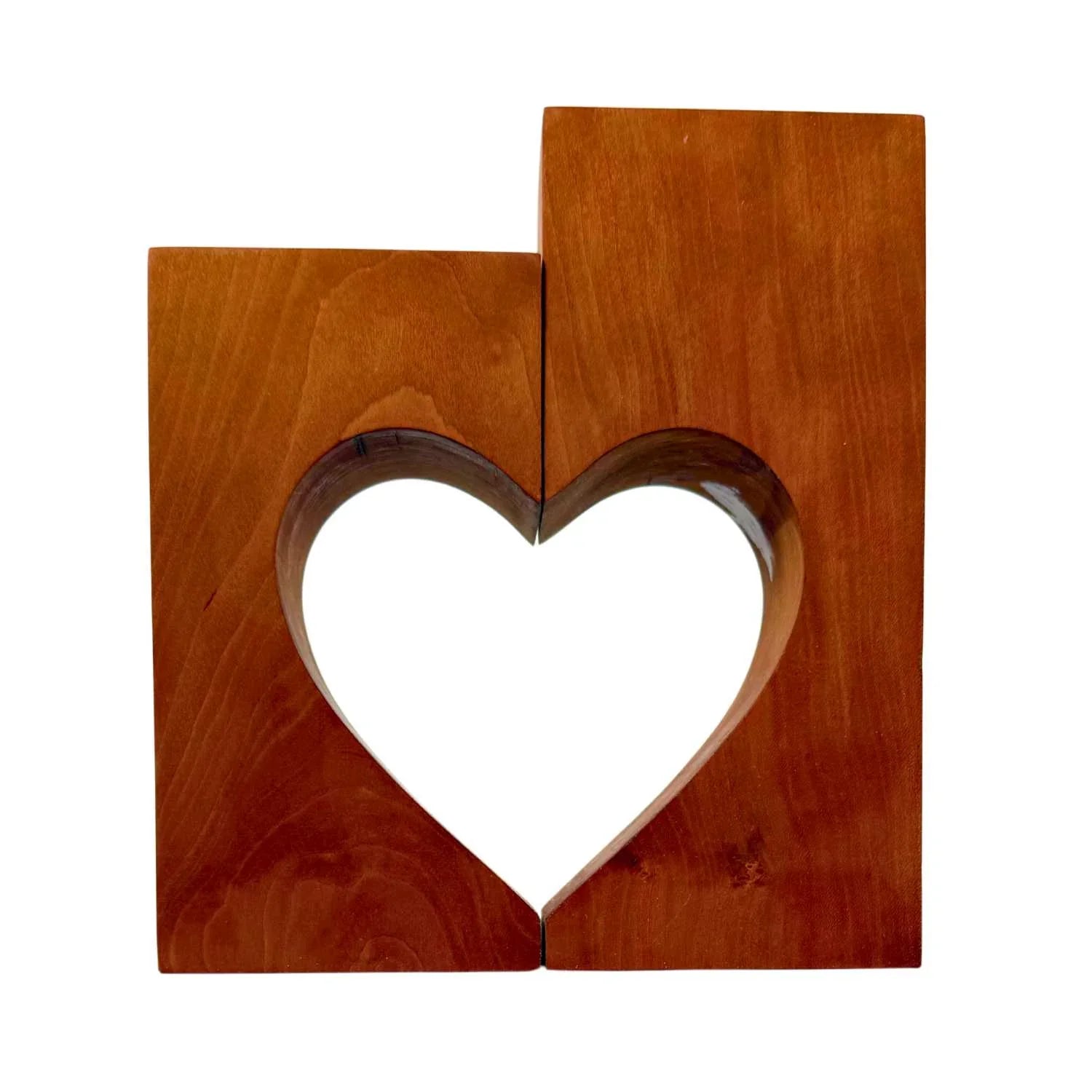 Two wooden blocks with a heart-shaped cutout in the center, natural wood texture
