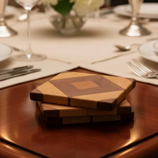 Stack of two wooden diamond-shaped coasters with geometric pattern on a polished table